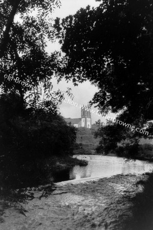 CARNDONAGH : NEW CHURCH TOWER FROM RIVER